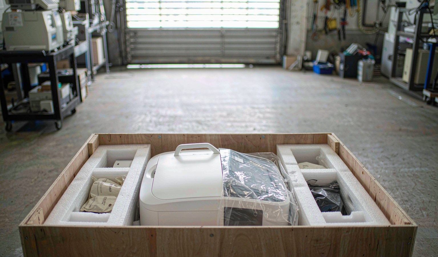 Analytical instrument packed in a wooden export crate with foam inserts